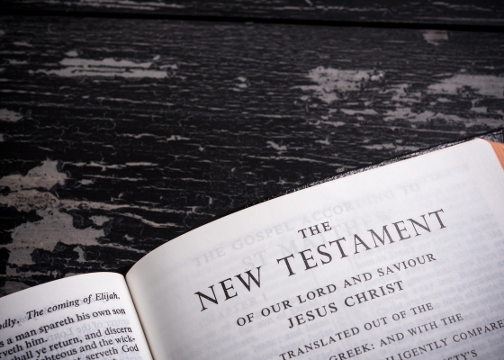 Bible open at New Testament title page